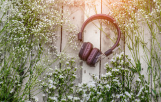 music therapy senior living near me headphones on wooden pallet with flowers