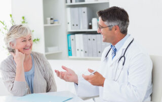 Senior woman talking with doctor