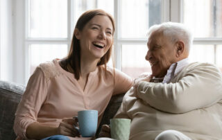 Woman visiting senior father in assisted living facility