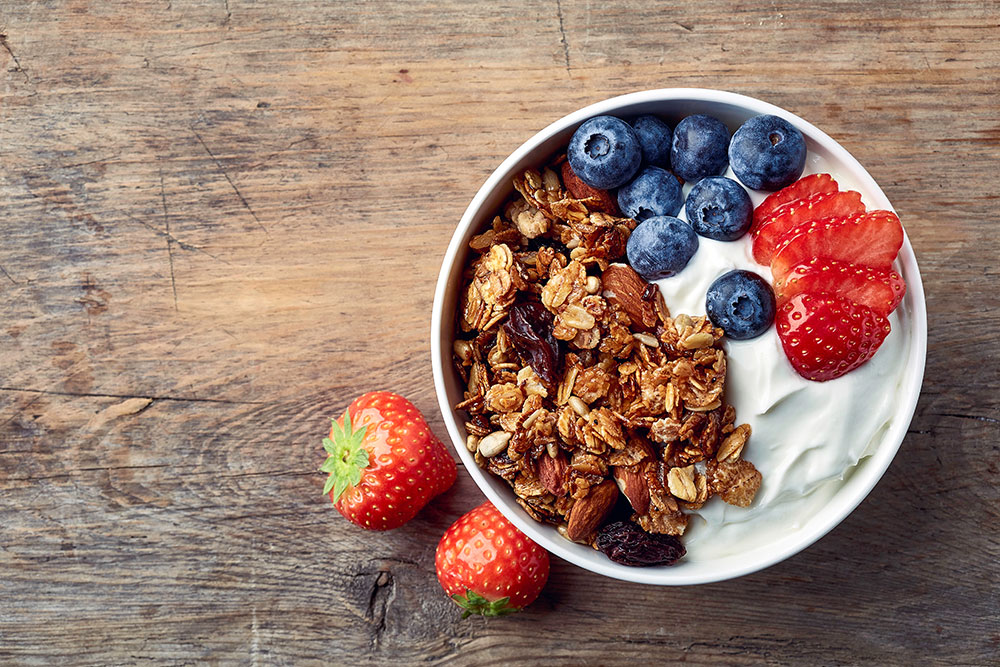 Bowl of yogurt with granola and fresh fruit