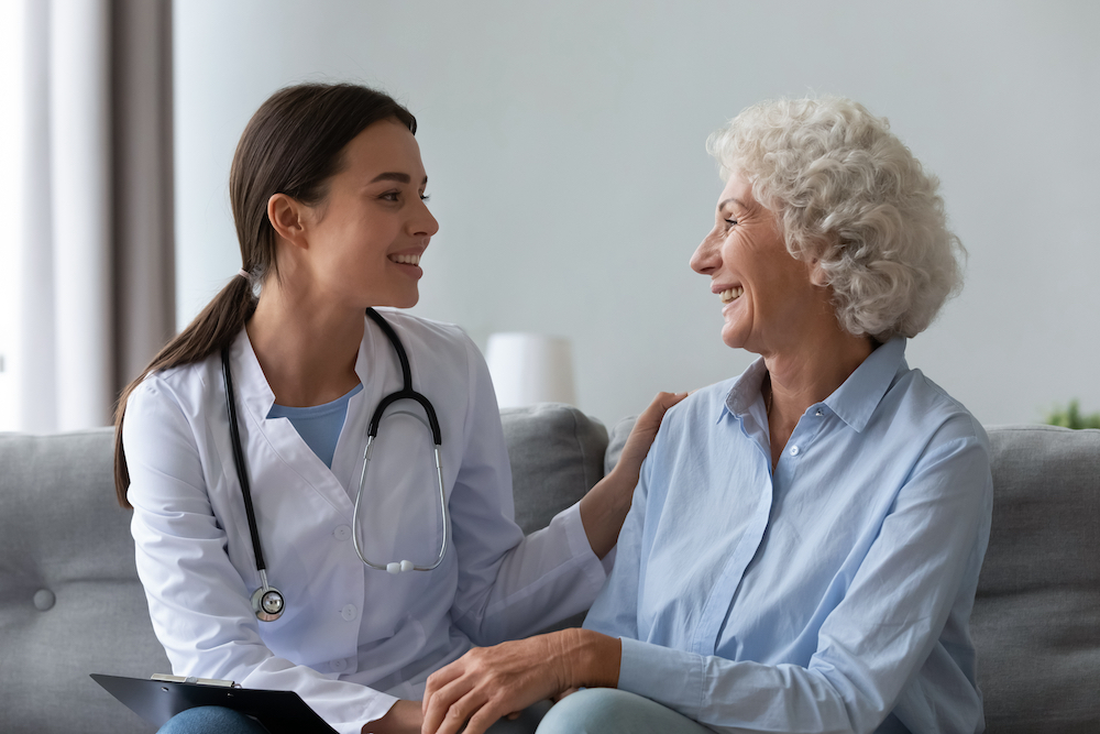 A senior woman talks with her doctor