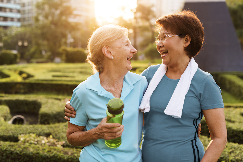 Two senior friends on a walk outdoors