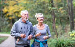A senior couple goes for a jog in the park