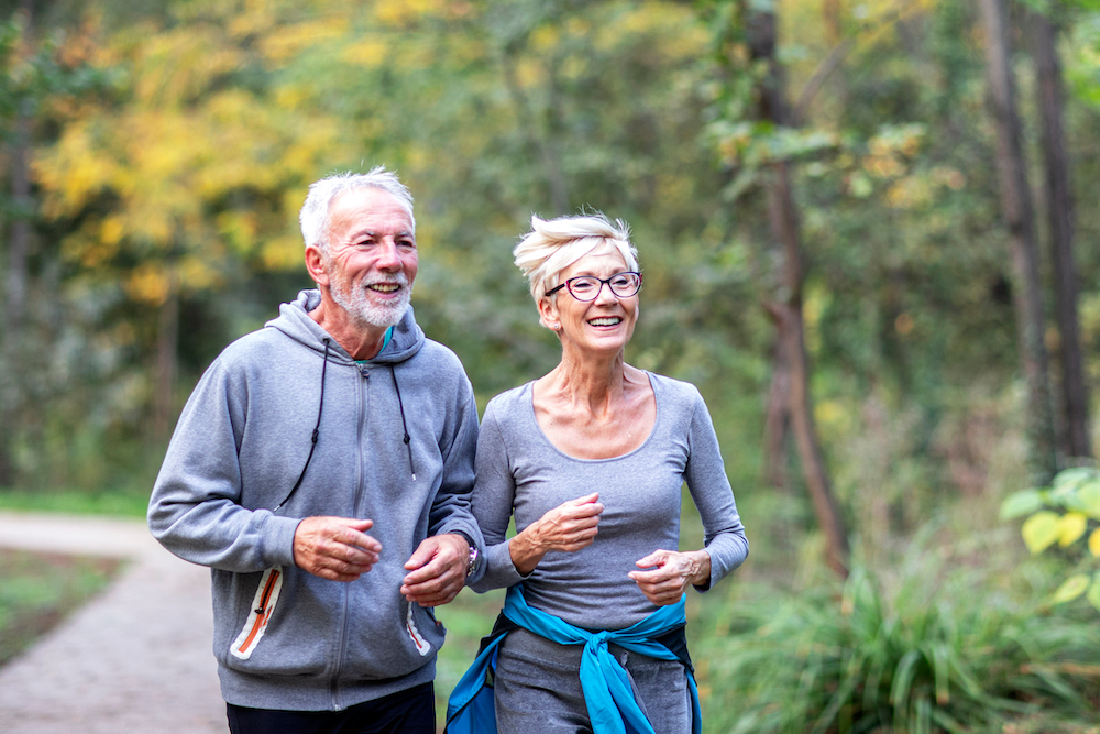 A senior couple goes for a jog in the park