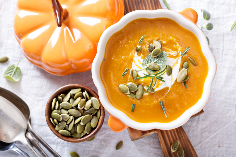 A healthy pumpkin soup with herbs and seeds