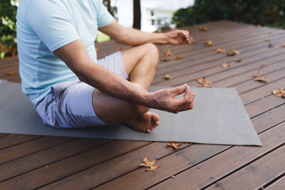 Man meditates in assisted living in macomb county.