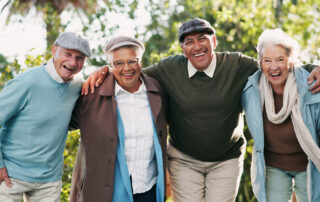 Group of seniors outside enjoying retirement communities near me